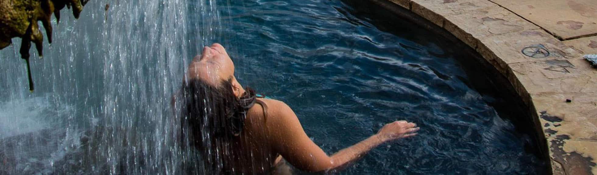 Woman enjoyig hot springs at colorado women's nature retreat