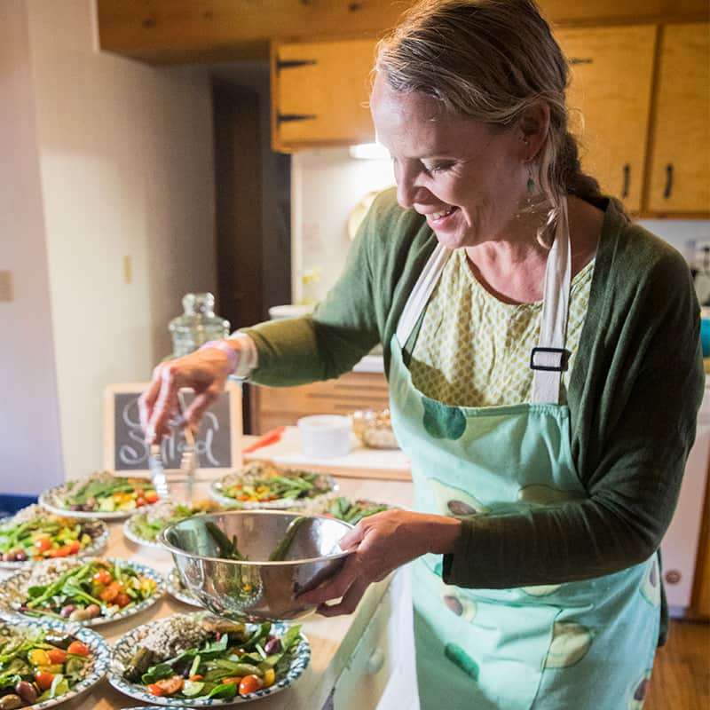 Image of Amy Ellis of Color Cuisine serving lunch at Kim Marie's Colorado women's nature retreat